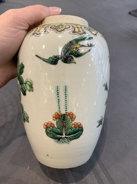 A pair of Chinese famille verte 'pheasant among flowering branches' vases and covers, 19th C.