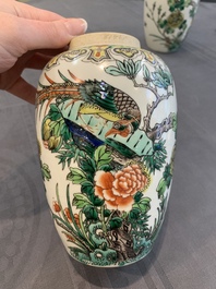 A pair of Chinese famille verte 'pheasant among flowering branches' vases and covers, 19th C.