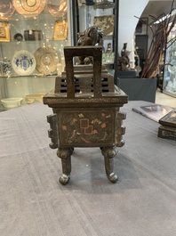 A large Vietnamese copper- and silver-inlaid rectangular 'Buddhist lion' censer and cover on stand, 19th C.