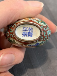 A collection of ten Chinese Canton enamel and porcelain snuff bottles, Qianlong mark, 19/20th C.