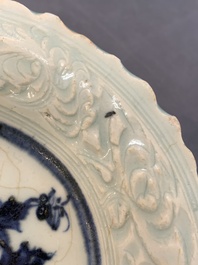 A Chinese blue and white celadon-ground plate with floral design, Ming