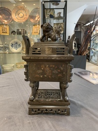 A large Vietnamese copper- and silver-inlaid rectangular 'Buddhist lion' censer and cover on stand, 19th C.