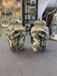 A pair of Chinese famille verte 'pheasant among flowering branches' vases and covers, 19th C.