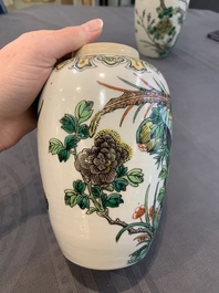 A pair of Chinese famille verte 'pheasant among flowering branches' vases and covers, 19th C.