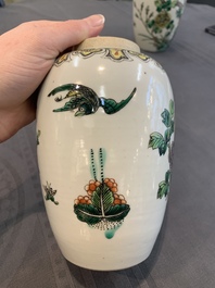 A pair of Chinese famille verte 'pheasant among flowering branches' vases and covers, 19th C.