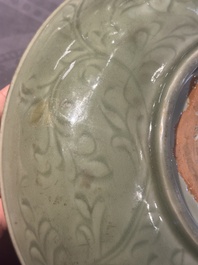 A Chinese Longquan celadon dish with floral design, Ming