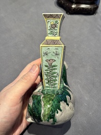 A pair of Chinese verte biscuit vases resting on Buddhist lions, Kangxi