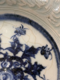 A Chinese blue and white celadon-ground plate with floral design, Ming