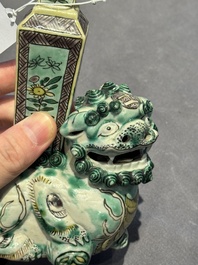 A pair of Chinese verte biscuit vases resting on Buddhist lions, Kangxi