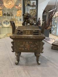 A large Vietnamese copper- and silver-inlaid rectangular 'Buddhist lion' censer and cover on stand, 19th C.
