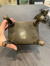 A large Vietnamese copper- and silver-inlaid rectangular 'Buddhist lion' censer and cover on stand, 19th C.