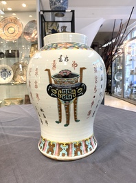 Three Chinese famille rose vases, one with cover, signed Wu Yu 吴玉, dated 1912