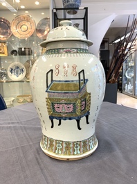 Three Chinese famille rose vases, one with cover, signed Wu Yu 吴玉, dated 1912