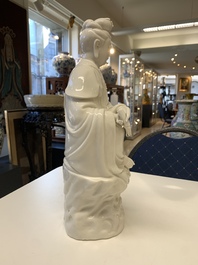 Three Chinese Dehua blanc de Chine figures of Guanyin, 20th C.