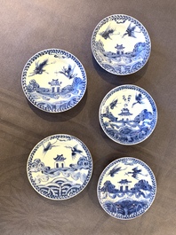 Eight Chinese blue and white cups, 14 saucers and four teapots, Kangxi/Qianlong