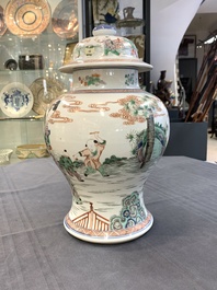 A Chinese famille verte 'ladies and boys' vase and cover, Kangxi