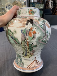A Chinese famille verte 'ladies and boys' vase and cover, Kangxi