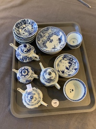 Eight Chinese blue and white cups, 14 saucers and four teapots, Kangxi/Qianlong