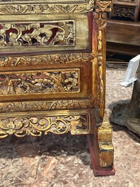 A pair of Chinese gilt-lacquered openworked wooden table screens with warriors on horseback, 19th C.