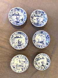 Eight Chinese blue and white cups, 14 saucers and four teapots, Kangxi/Qianlong