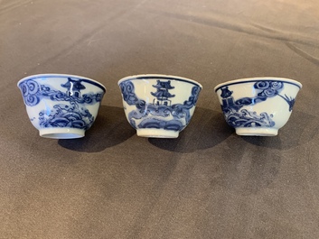 Eight Chinese blue and white cups, 14 saucers and four teapots, Kangxi/Qianlong