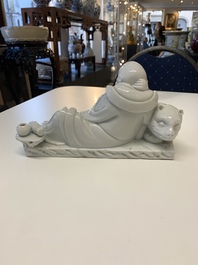 A Chinese Dehua blanc de Chine figure of a Luohan reclining on a tiger, Dehua and Bo Ji Yu Ren 博及漁人 mark, 20th C.
