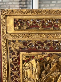 A pair of Chinese gilt-lacquered openworked wooden table screens with warriors on horseback, 19th C.