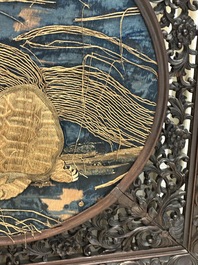 A Chinese wooden table screen with an embroidered silk with turtle design, 19th C.