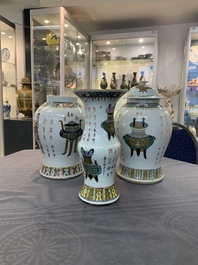Three Chinese famille rose vases, one with cover, signed Wu Yu 吴玉, dated 1912