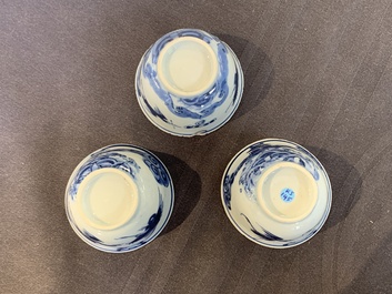 Eight Chinese blue and white cups, 14 saucers and four teapots, Kangxi/Qianlong