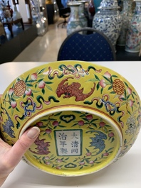 A Chinese famille rose yellow-ground 'bats and peaches' plate, Tongzhi mark and of the period