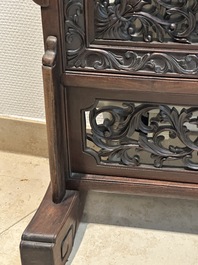 A Chinese wooden table screen with an embroidered silk with turtle design, 19th C.