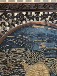 A Chinese wooden table screen with an embroidered silk with turtle design, 19th C.