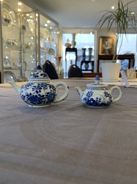 Eight Chinese blue and white cups, 14 saucers and four teapots, Kangxi/Qianlong