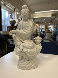 Three Chinese Dehua blanc de Chine figures of Guanyin, 20th C.