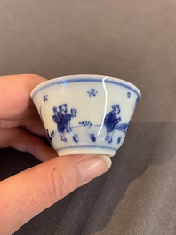 Eight Chinese blue and white cups, 14 saucers and four teapots, Kangxi/Qianlong