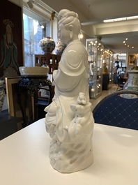 Three Chinese Dehua blanc de Chine figures of Guanyin, 20th C.