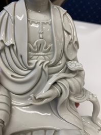 Three Chinese Dehua blanc de Chine figures of Guanyin, 20th C.