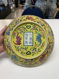 A Chinese famille rose yellow-ground 'bats and peaches' plate, Tongzhi mark and of the period