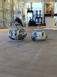 Eight Chinese blue and white cups, 14 saucers and four teapots, Kangxi/Qianlong