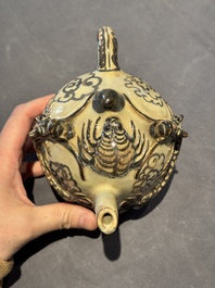 A Chinese Cizhou 'cadogan' ewer with dragons, Yuan/Ming