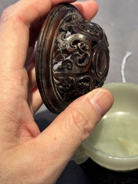 A Chinese white jade bowl with ruyi-shaped handles, wooden cover and stand, 18/19th C.