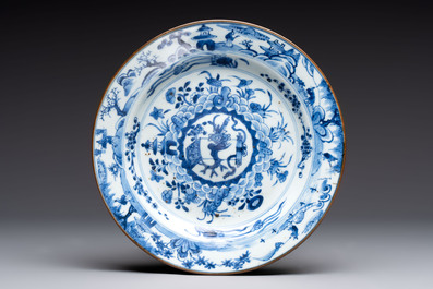 Five Chinese blue and white plates with raised central medallions, Kangxi/Yongzheng