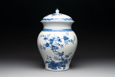 A Chinese blue and white 'birds among flowering branches' vase and cover, 19th C.