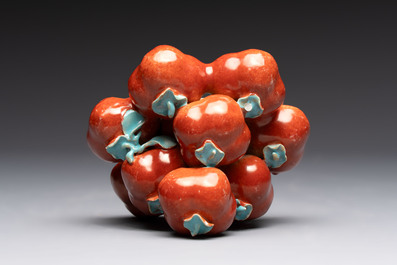 A pair of Chinese polychrome 'persimmons' groups on wooden stands, 19th C.