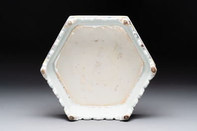 A Chinese famille rose hexagonal stand with antiquities, Yongzheng/Qianlong