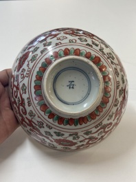 A Chinese wucai 'dragon and phoenix' bowl, Shi 石 mark, Transitional period