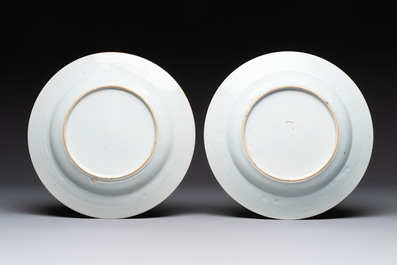 A pair of Chinese famille rose 'winged putti' plates, Yongzheng/Qianlong