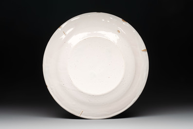 A blue and white Dutch Delft armorial dish, 17th C.