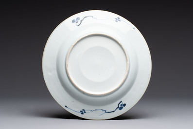 Five Chinese blue and white plates with raised central medallions, Kangxi/Yongzheng